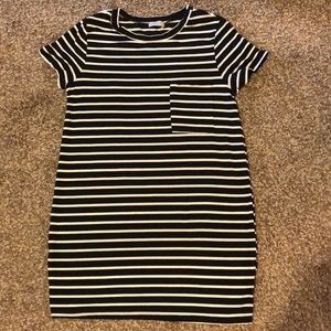 Black and white t shirt. One pocket.